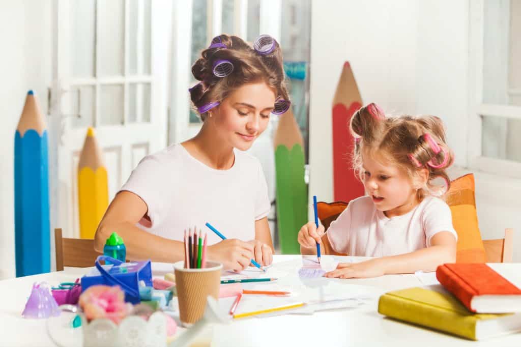 the-young-mother-and-her-little-daughter-drawing-P8QENEX-1024x682 7 Fun Activities That You Can Do At Home  - Braces and Invisalign in Liberty, Missouri - Kanning Orthodontics